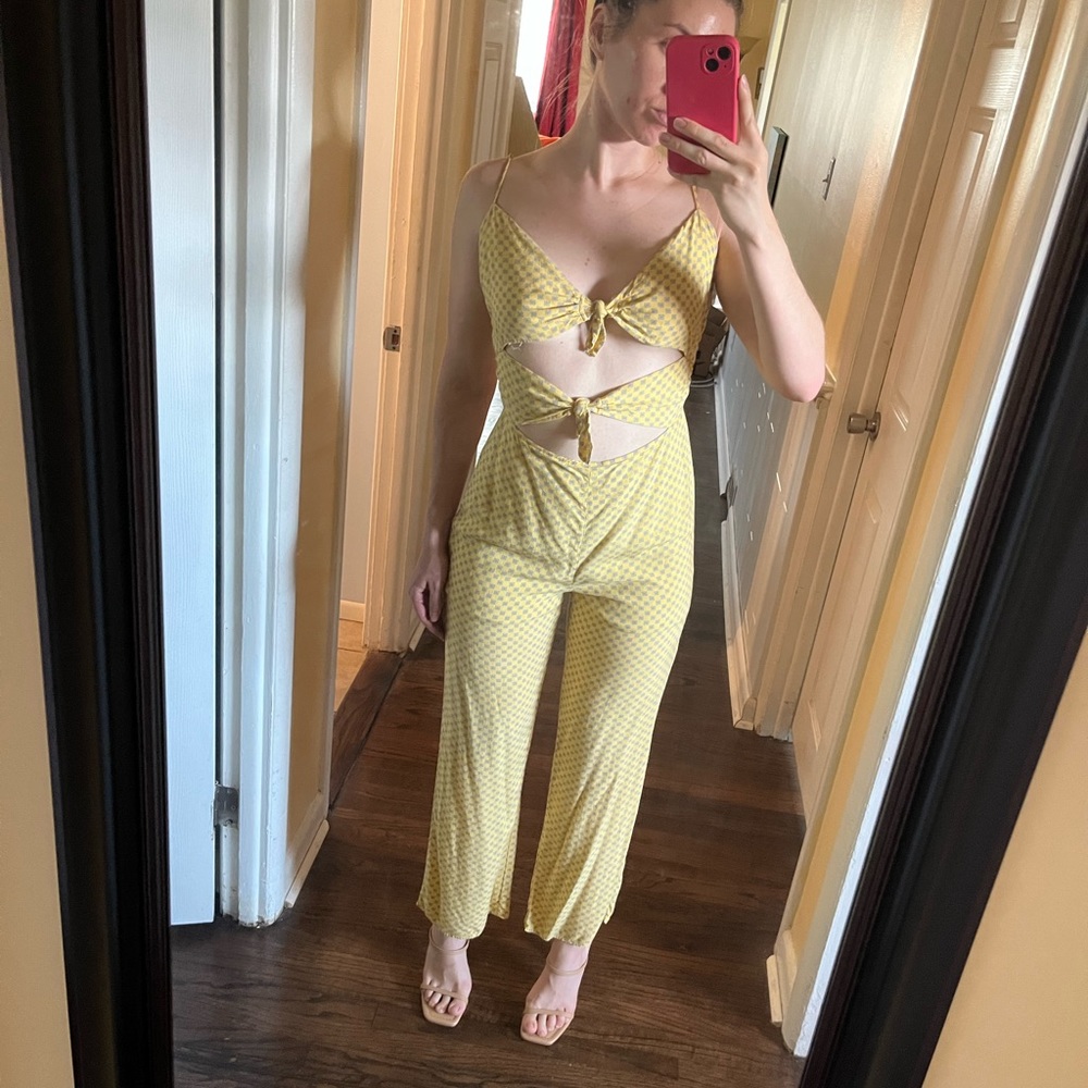 Cute sexy yellow jumpsuit featuring ties in the front